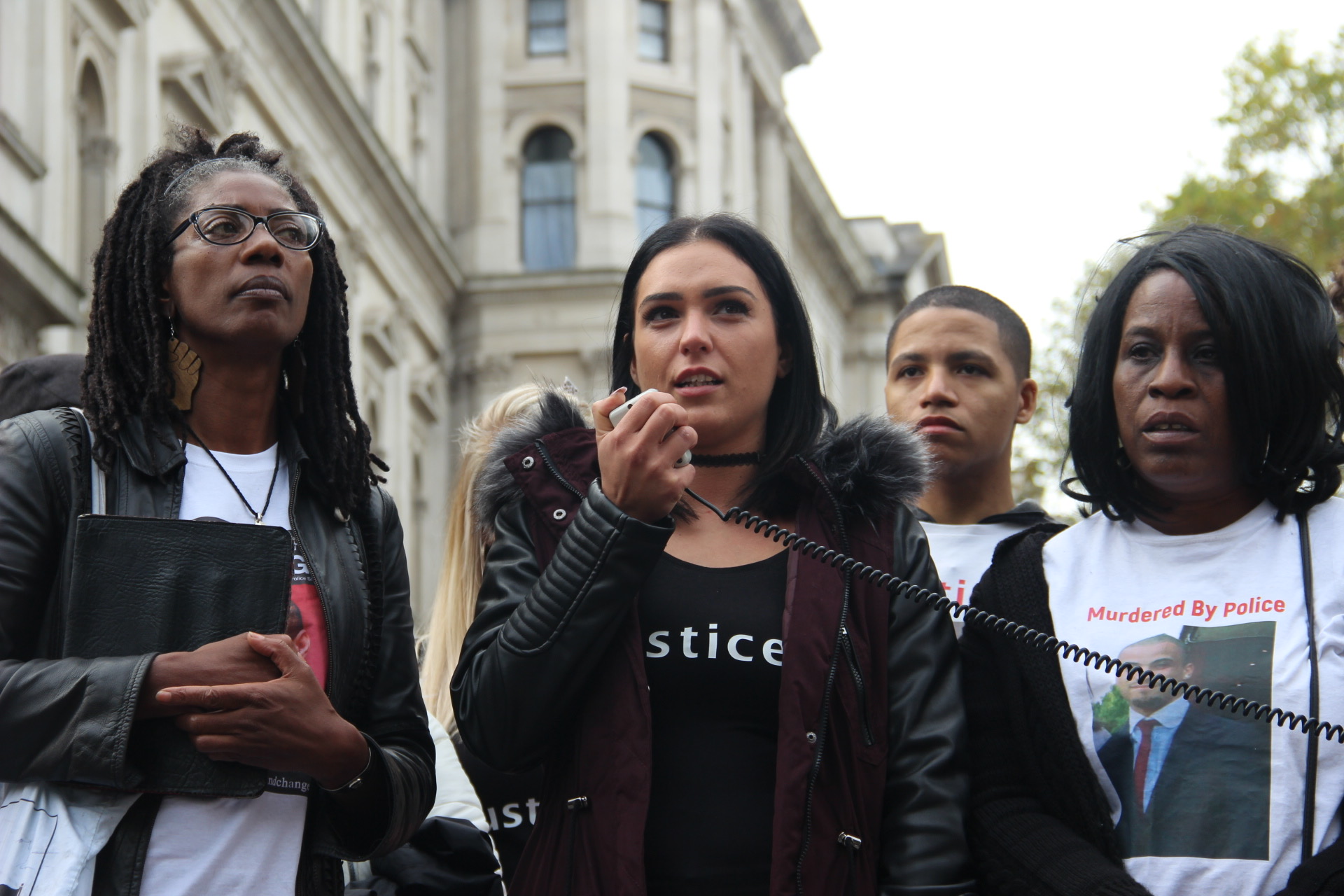 Group of women making protest speech over a loudspeaker